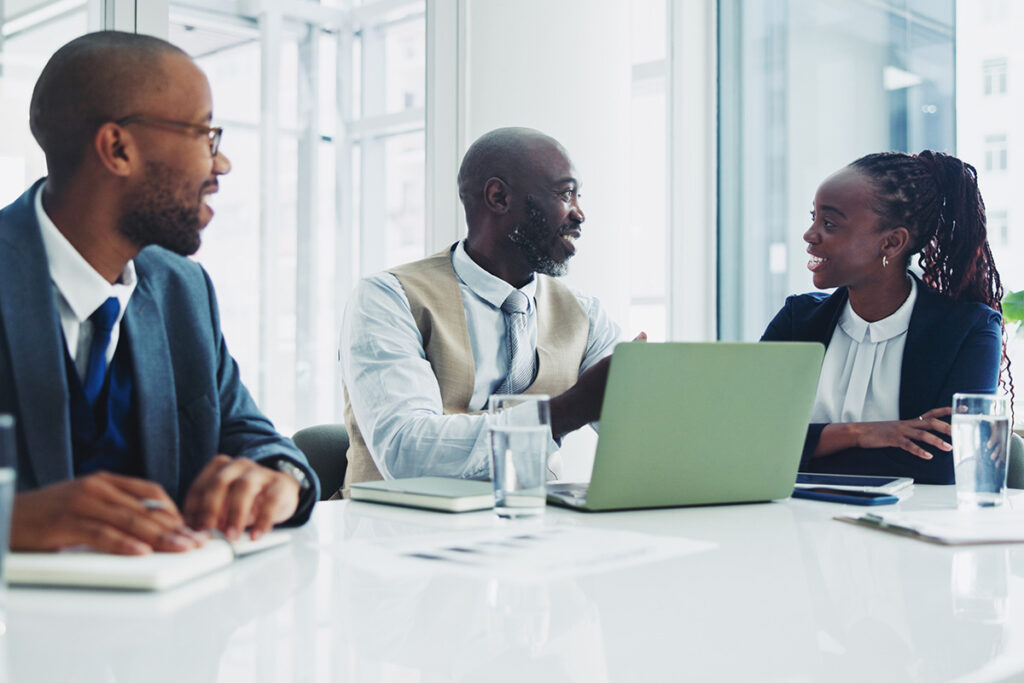 Team discussing strategies to design affordable online courses for universities
